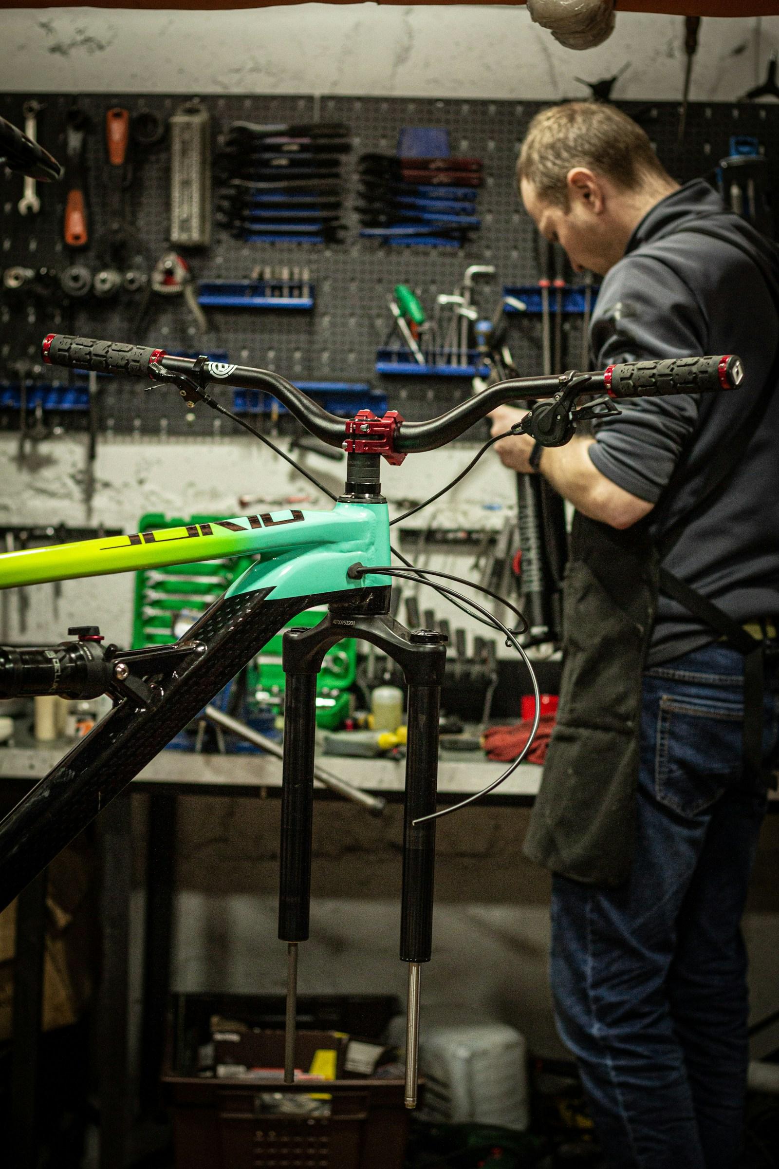 Modern bicycle workshop with a bike on a repair stand and neatly organized tools