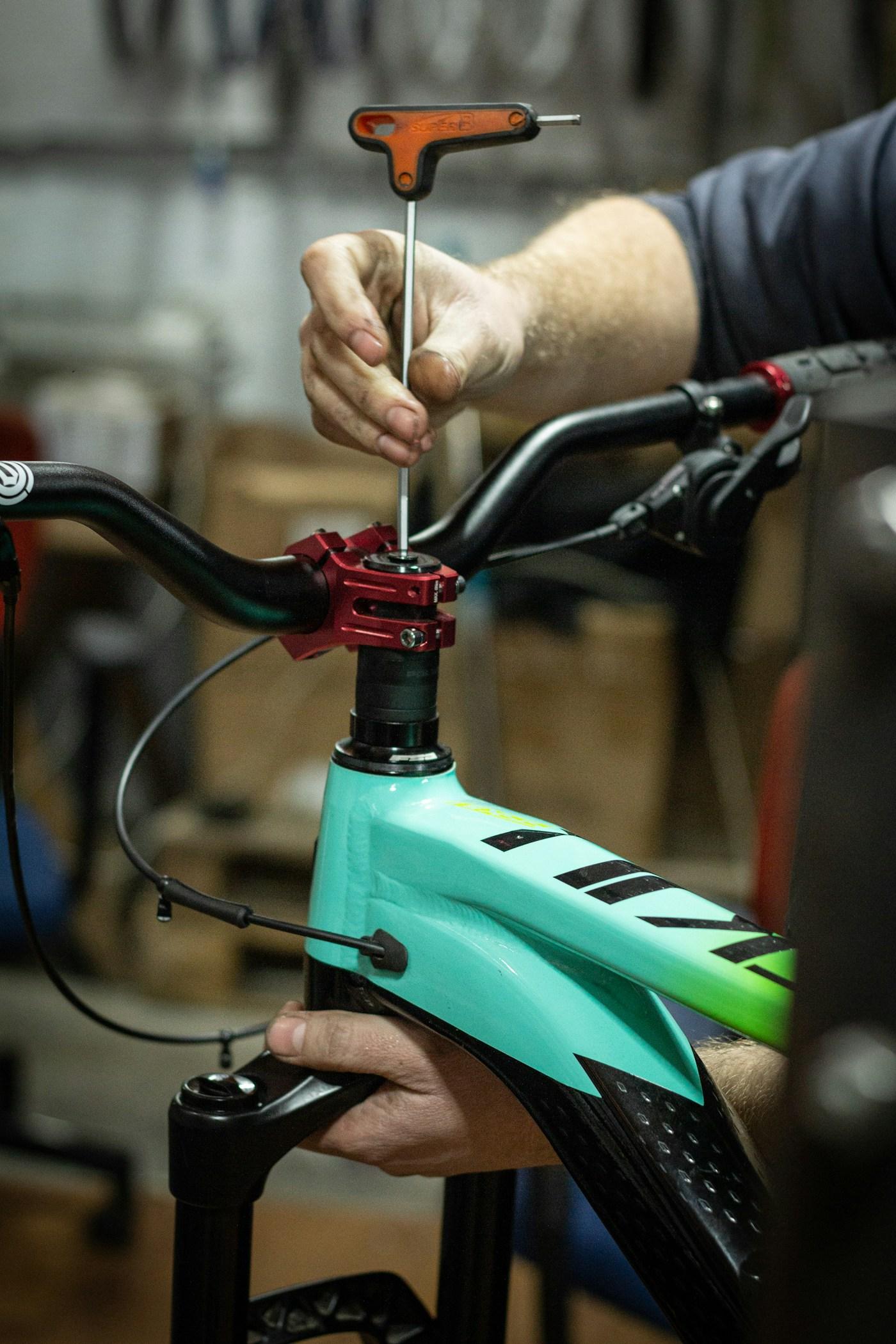Self-service zone with professional tools and a mountain bike